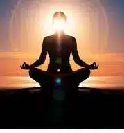 Person meditating in soft light